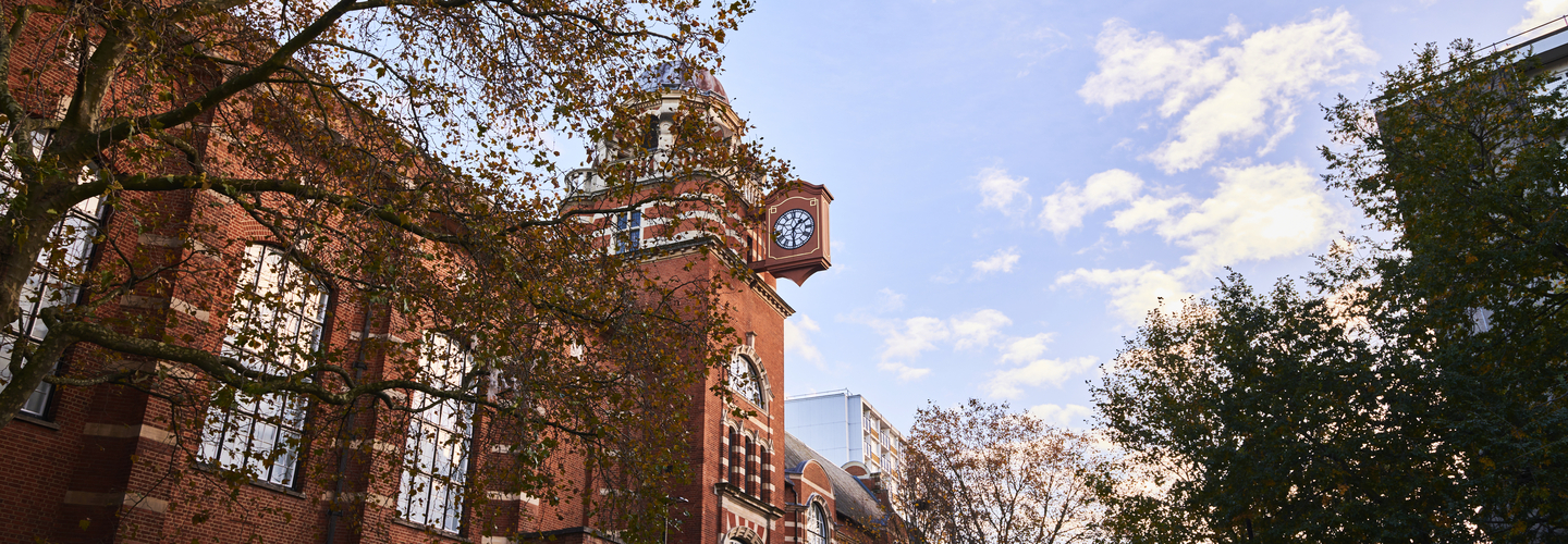 College building with a clock at the Clerkenwell campus of City St George's, University of London