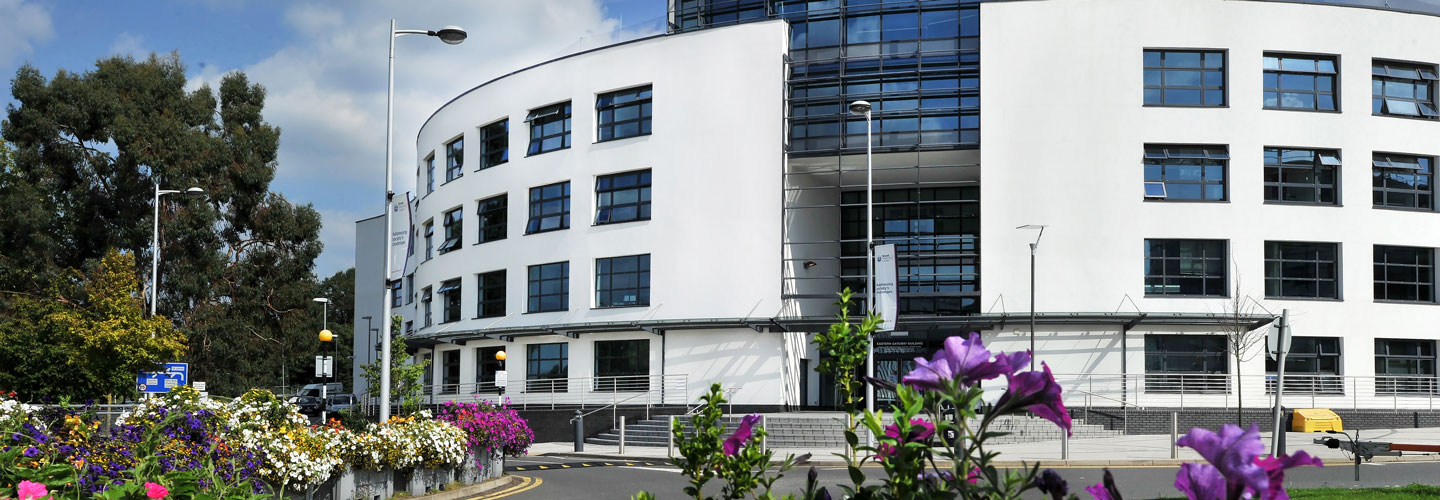 Brunel University Eastern Gateway Building, a modern white curved structure with large glass windows