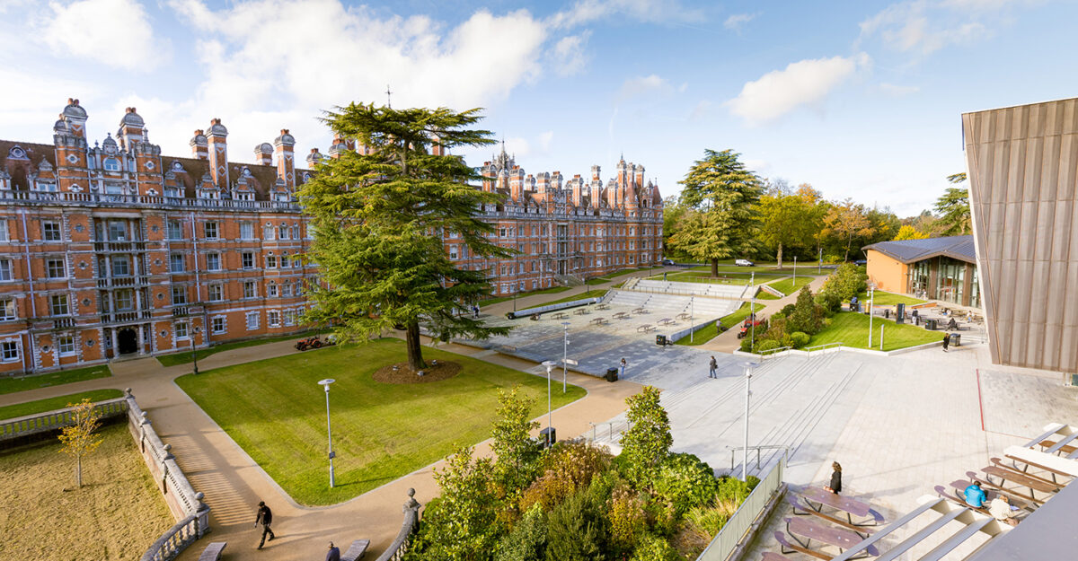 RHUL building surrounded by beautiful gardens.